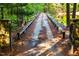 Gated entrance and private drive leading to a tranquil setting at 10305 Old Creedmoor Rd, Raleigh, NC 27613