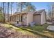 Tan house exterior with screened porch and landscaping at 109 Gristmill Ln, Chapel Hill, NC 27514