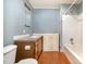 Bathroom featuring vanity with storage and a shower/tub combo at 1109 Mays Chapel Rd, Bear Creek, NC 27207