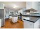 Eat in kitchen with stainless steel appliances and black tiled countertops at 1109 Mays Chapel Rd, Bear Creek, NC 27207