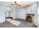 Open floor plan with stone fireplace and view to the dining room at 1109 Mays Chapel Rd, Bear Creek, NC 27207