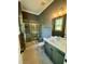 Modern bathroom with tiled walk-in shower, sleek vanity, and elegant fixtures at 1229 Azalea Garden Cir, Raleigh, NC 27603