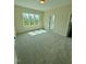 Bright bedroom with large window offering a scenic view and plush carpeting at 1229 Azalea Garden Cir, Raleigh, NC 27603