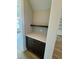Charming butler's pantry with dark wood cabinets and a light countertop at 1229 Azalea Garden Cir, Raleigh, NC 27603