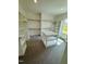 Spacious walk-in closet featuring custom shelving and a convenient center island for organization at 1229 Azalea Garden Cir, Raleigh, NC 27603