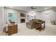 Finished basement with a fireplace, sectional sofa, and large windows at 1300 Caistor Ln, Raleigh, NC 27614