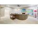 Finished basement recreation area with sectional sofa and fireplace at 1300 Caistor Ln, Raleigh, NC 27614