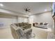 Finished basement recreation area with sectional sofa and plenty of space at 1300 Caistor Ln, Raleigh, NC 27614