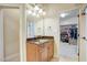 Bathroom with granite vanity and walk in closet at 1300 Caistor Ln, Raleigh, NC 27614