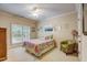 Bright bedroom with a queen bed, window seating, and plenty of natural light at 1300 Caistor Ln, Raleigh, NC 27614