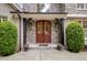 Elegant double front doors with stone accents at 1300 Caistor Ln, Raleigh, NC 27614