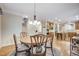 Bright kitchen with island, stainless steel appliances, and hardwood floors at 1300 Caistor Ln, Raleigh, NC 27614