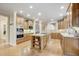 Modern kitchen with stainless steel appliances, large island, and hardwood floors at 1300 Caistor Ln, Raleigh, NC 27614