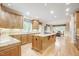 Gourmet kitchen with granite countertops, custom cabinetry, and stainless steel appliances at 1300 Caistor Ln, Raleigh, NC 27614