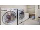 Laundry room with modern washer and dryer at 1300 Caistor Ln, Raleigh, NC 27614