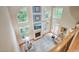 Spacious living room with a fireplace and large windows offering abundant natural light at 1300 Caistor Ln, Raleigh, NC 27614