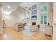Spacious living room with hardwood floors, high ceilings, and a fireplace at 1300 Caistor Ln, Raleigh, NC 27614