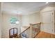 Grand staircase with an iron railing and a chandelier at 1300 Caistor Ln, Raleigh, NC 27614