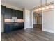 Finished basement with dark cabinetry and wet bar at 131 Evander Way, Pittsboro, NC 27312