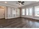 Spacious basement with built-in shelving and hardwood floors at 131 Evander Way, Pittsboro, NC 27312