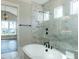 Elegant bathroom with soaking tub and marble shower at 131 Evander Way, Pittsboro, NC 27312