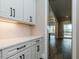 White shaker cabinets and quartz countertops in a butlers pantry at 131 Evander Way, Pittsboro, NC 27312