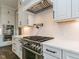 Modern kitchen featuring stainless steel appliances and white cabinetry at 131 Evander Way, Pittsboro, NC 27312