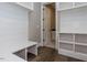Convenient laundry room with built-in shelving and bench at 131 Evander Way, Pittsboro, NC 27312