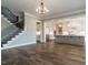 Open concept living and kitchen area with hardwood floors at 131 Evander Way, Pittsboro, NC 27312