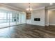 Living room with hardwood floors, fireplace and built-in shelving at 131 Evander Way, Pittsboro, NC 27312