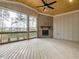 Relaxing screened porch with fireplace and wood flooring at 131 Evander Way, Pittsboro, NC 27312