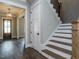 Elegant staircase with white risers and dark wood treads at 131 Evander Way, Pittsboro, NC 27312