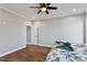 Bright bedroom with wood-look floors and view of backyard at 137 Glenwood Pl, Kenly, NC 27542