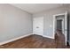 Spacious bedroom with hardwood floors and double doors to closet at 137 Glenwood Pl, Kenly, NC 27542