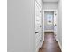 Clean hallway with hardwood floors and neutral-colored walls at 137 Glenwood Pl, Kenly, NC 27542