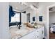 Bathroom with granite countertops, double sinks, and modern lighting at 137 Glenwood Pl, Kenly, NC 27542