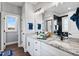 Bathroom features double sinks, granite countertops, modern fixtures and a walk-in shower at 137 Glenwood Pl, Kenly, NC 27542