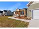 Well maintained home with a covered porch, two car garage, and lovely landscaping at 137 Glenwood Pl, Kenly, NC 27542