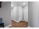 Bright hallway features wood flooring, doors with classic trim and hardware, and recessed lighting at 137 Glenwood Pl, Kenly, NC 27542