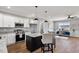 Open kitchen featuring stainless steel appliances, a kitchen island, and modern finishes at 137 Glenwood Pl, Kenly, NC 27542