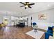 Open-concept living room boasts a kitchen island and modern decor with an adjacent dining area at 137 Glenwood Pl, Kenly, NC 27542
