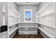 Walk-in pantry with custom shelving and a window to let in natural light at 137 Glenwood Pl, Kenly, NC 27542
