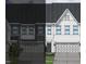 Two-story townhome with attached garage and front landscaping at 194 Nimble Way # 217, Clayton, NC 27520