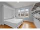 Well-lit bedroom with a murphy bed and shelves at 215 Ellsworth Manor Dr, Hillsborough, NC 27278