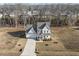 Aerial shot of a well-maintained two-story home with a long driveway and a manicured front yard at 221 Old Hickory Dr, Raleigh, NC 27603