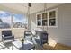 Cozy back porch with a swing, comfortable seating, and views of the surrounding neighborhood at 221 Old Hickory Dr, Raleigh, NC 27603