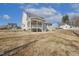 Expansive backyard view showcasing a screened porch, perfect for outdoor entertaining and relaxation at 221 Old Hickory Dr, Raleigh, NC 27603