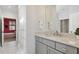 Bathroom vanity with neutral countertops and a view into a connected bedroom at 221 Old Hickory Dr, Raleigh, NC 27603