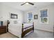Serene bedroom with a classic wooden bed frame, soft carpet, and plenty of natural light at 221 Old Hickory Dr, Raleigh, NC 27603