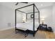 Bedroom with a four-poster bed, ceiling fan, neutral rug, and bench seating at 221 Old Hickory Dr, Raleigh, NC 27603
